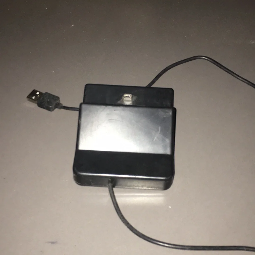 Cell phone charging base adapter